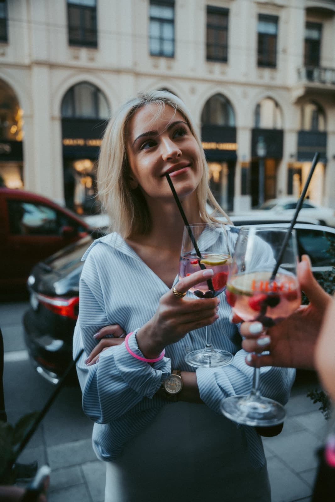 Guests with aperitifs on the terrace in daylight